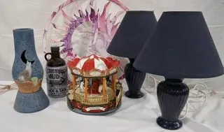 Assorted Home Decor: Dark Blue Table Lamps, Wolf Vase, Mississippi Mud Growler bottle,Vintage battery Carousel, Sun Wall Art decor