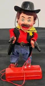 Vintage Battery-Operated Remote-Controlled Cowboy Toy with Dual Pistols and Wired Controller