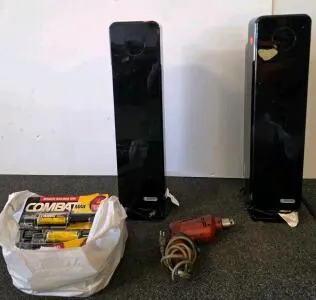 Insignia Floor Standing Air Conditioner plugged in and functioning Gloss Black, Handware tool plugged in and functioning, bag of roach killers