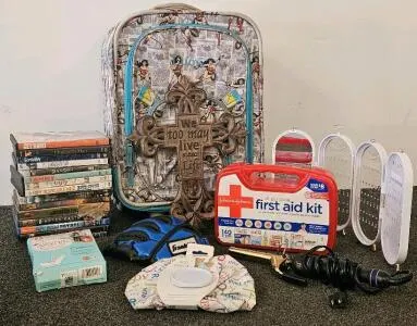 Wonder Woman Rolling Suitcase, DVDs, Baseball Glove, First Aid Kit, and More (a)